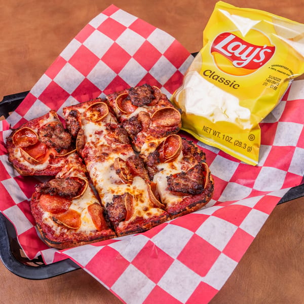 Mark & Monica's pepperoni and sausage pizza slices with a bag of Lay's chips.